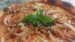 Pizza with anchovies Tuna Onion and Mozzarella