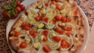 Focaccia with tomatoes onions Anchovies Brie with a Dough At Chestnuts