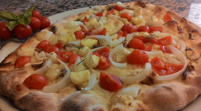 Focaccia con tomates cebolla anchoas Brie con una masa a las castañas