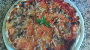 Pizza with mushrooms and raisins Sultana Trifolati