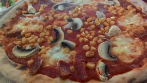 Pizza with mushrooms and salami Spicy Corn
