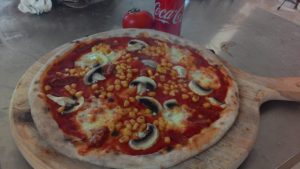 Pizza with mushrooms and salami Spicy Corn