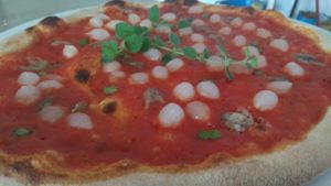 Anchovies pizza with onions and marjoram
