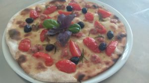 Focaccia with tomatoes Sausage and Black Olives