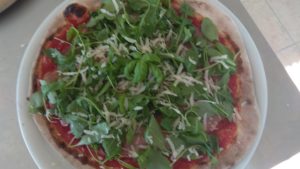 Pizza with Ham Rocket and Parmesan Shavings