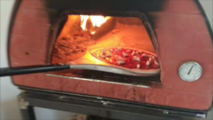Pizza con rúcula y Grana Scamorza