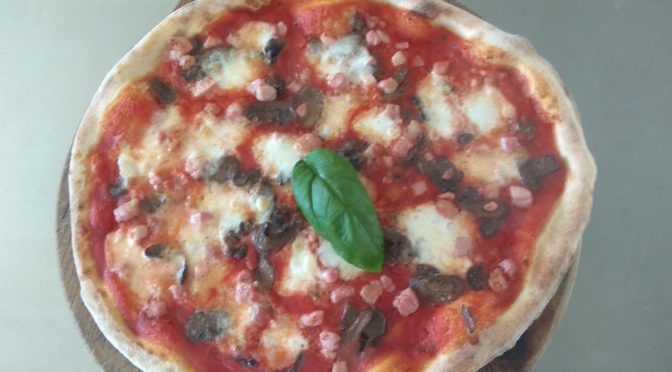 Pizza With Tomato Mozzarella Pancetta and Mushrooms