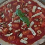 Pizza with Seafood Salad and Cherry Tomatoes