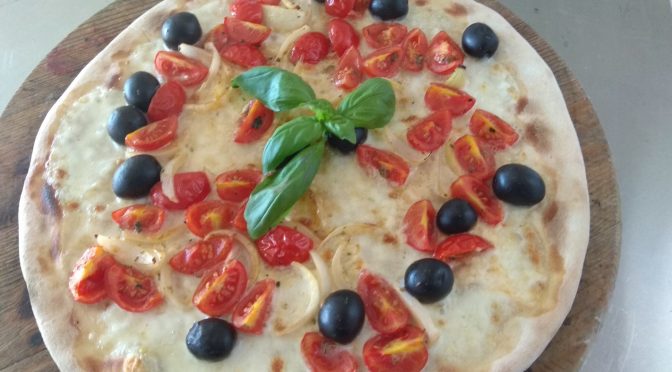 Pizza With Mozzarella Tomatoes Onions and Olives