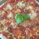 Pizza with lentils, corn and soy sprouts