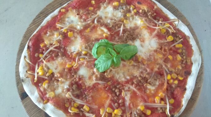 Pizza with lentils, corn and soy sprouts